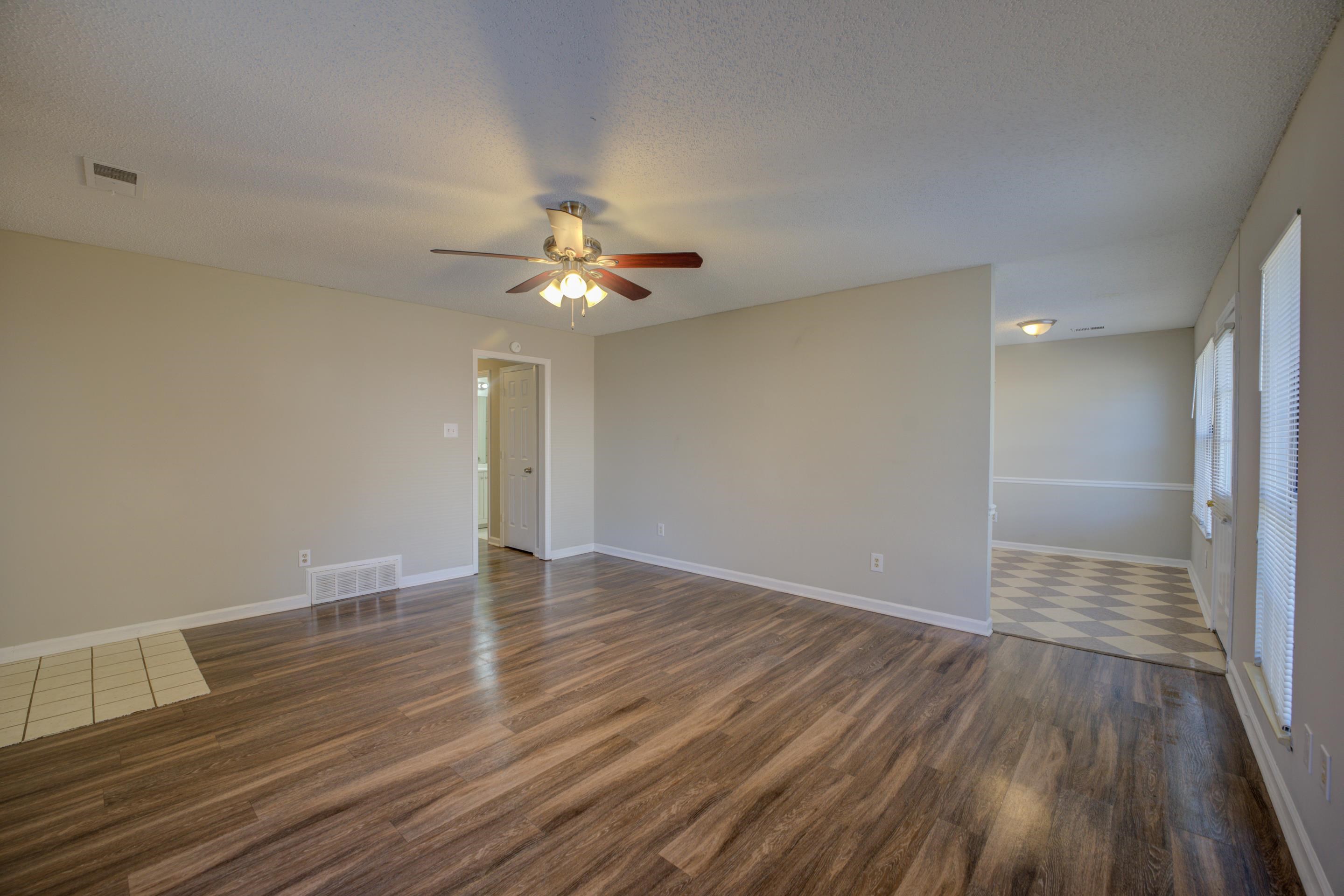 3501 Chowning Road Memphis, TN 38135 - Photo 2 of 25 Spare room with a textured ceiling, dark hardwood / wood-style floors, and ceiling fan