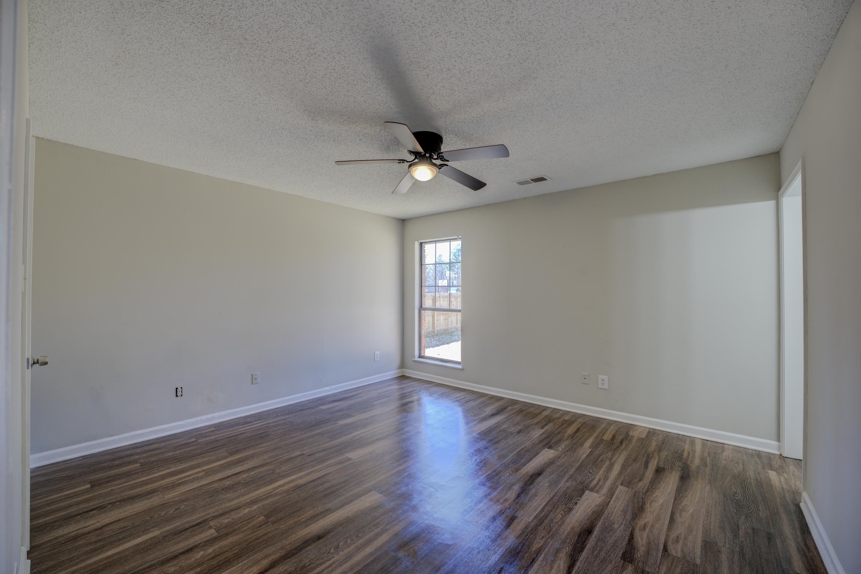 3501 Chowning Road Memphis, TN 38135 - Photo 5 of 25 Unfurnished room featuring ceiling fan, dark hardwood / wood-style floors, and a textured ceiling