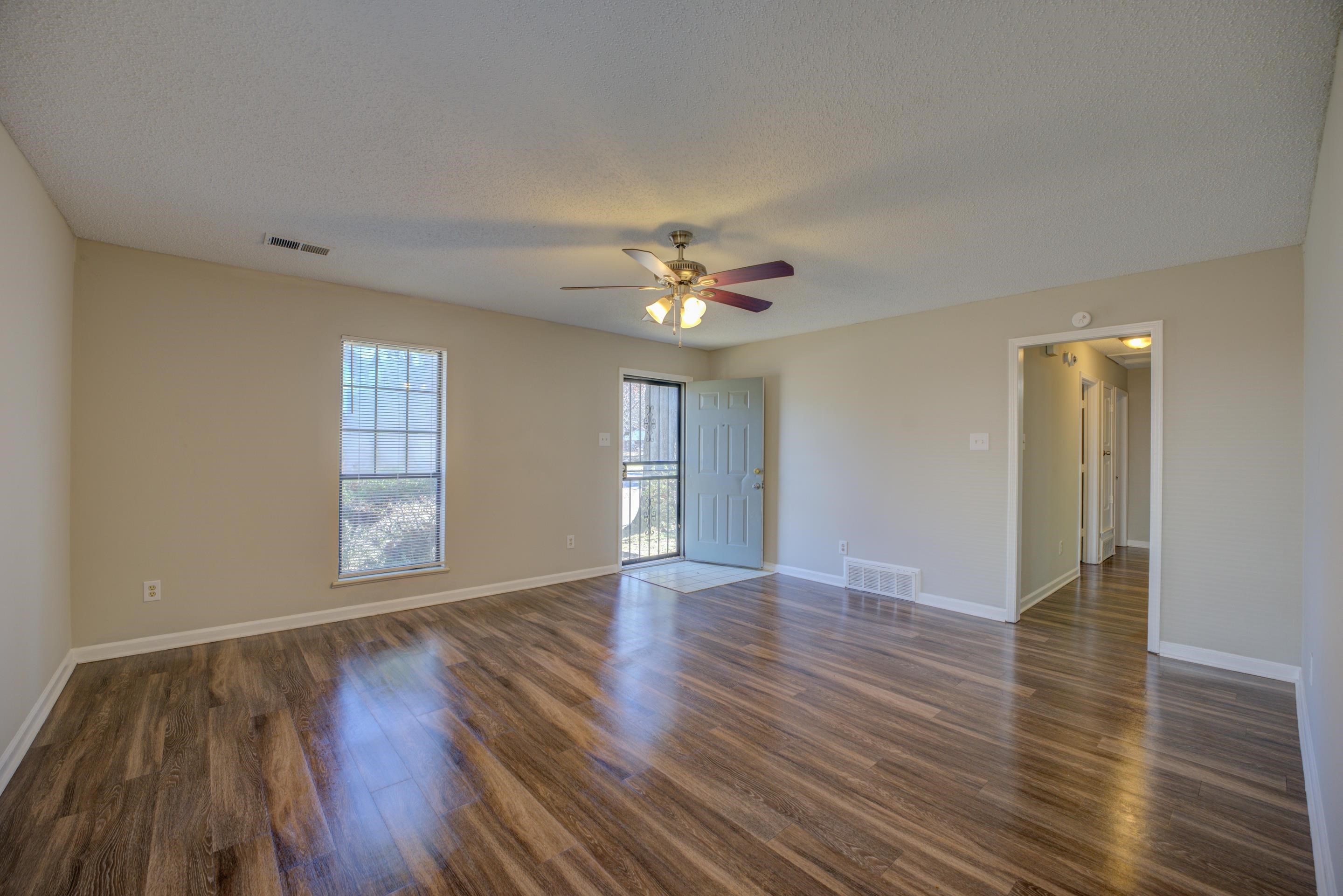 3501 Chowning Road Memphis, TN 38135 - Photo 8 of 25 Spare room featuring ceiling fan, dark wood-type flooring, and a textured ceiling