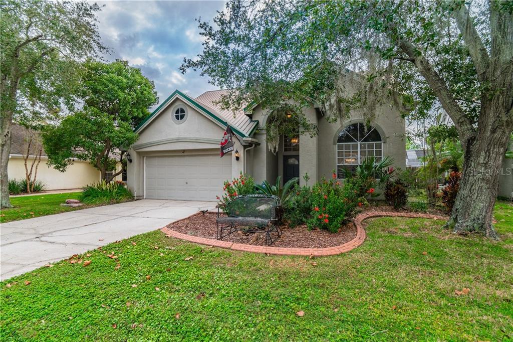 Beautiful Landscaping with long drive way and two car garage for ample parking