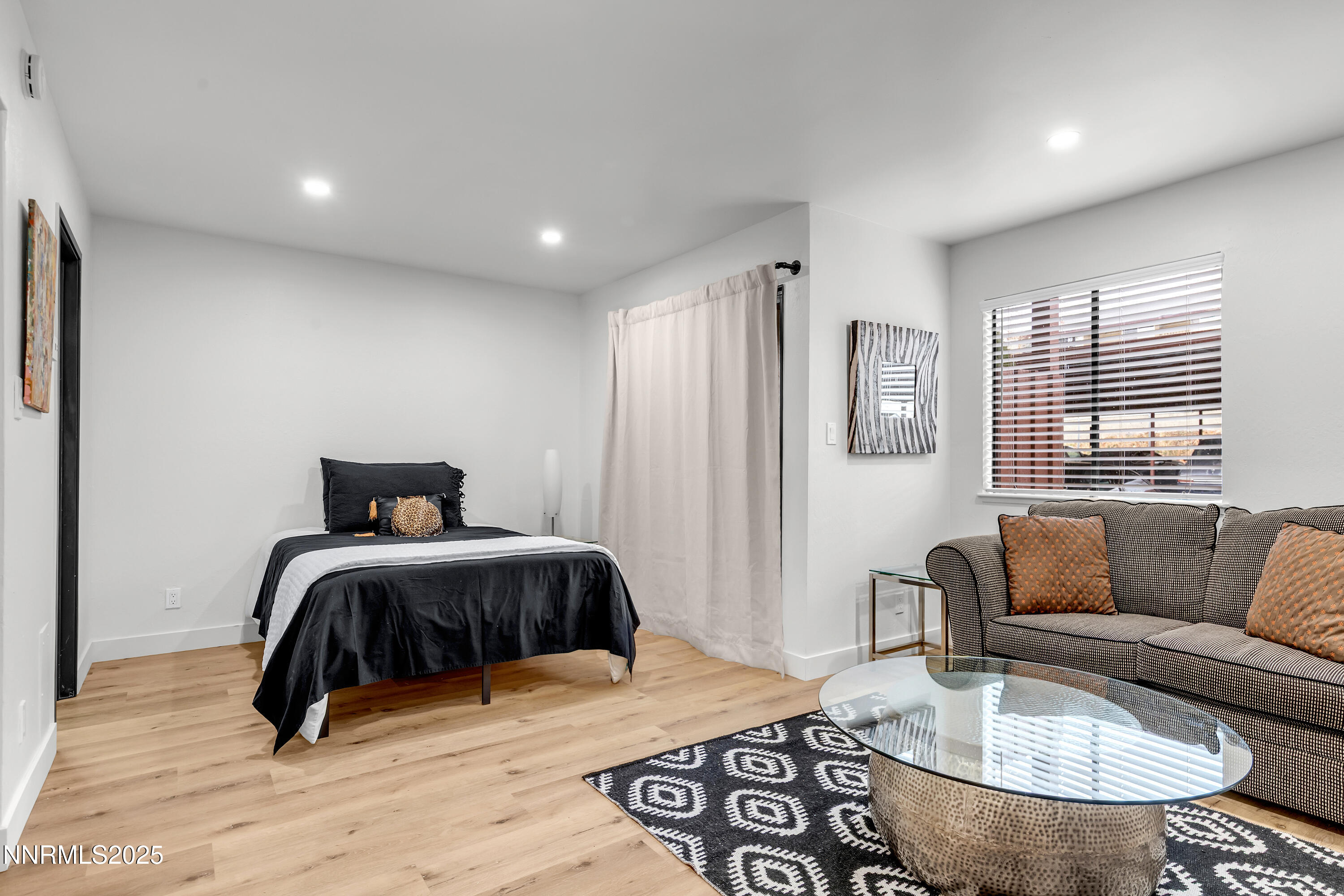 1000 Beck Drive, Unit 163 Reno, NV 89509 - Photo 9 of 14 a bedroom with furniture and wooden floor