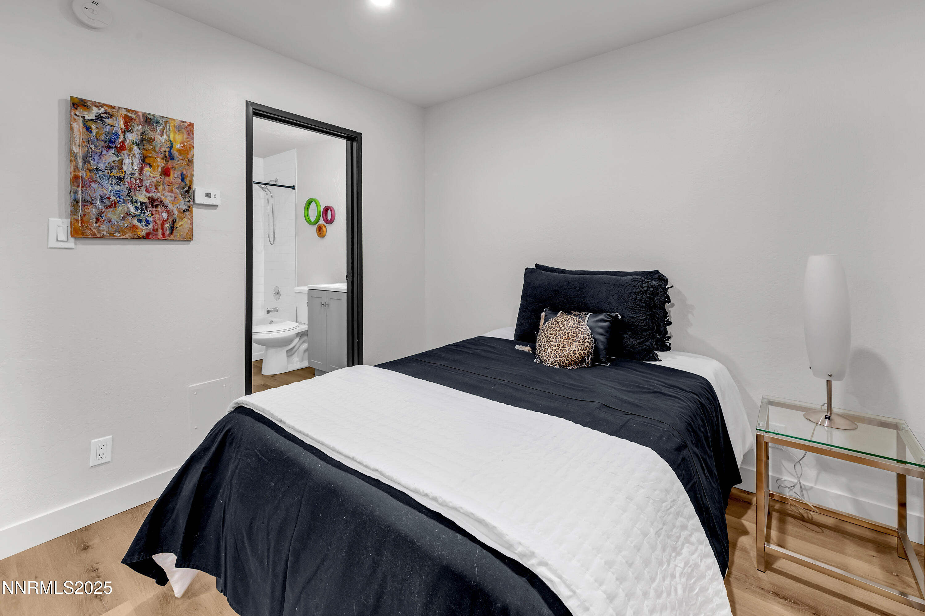 1000 Beck Drive, Unit 163 Reno, NV 89509 - Photo 10 of 14 a bedroom with a bed and wooden floor