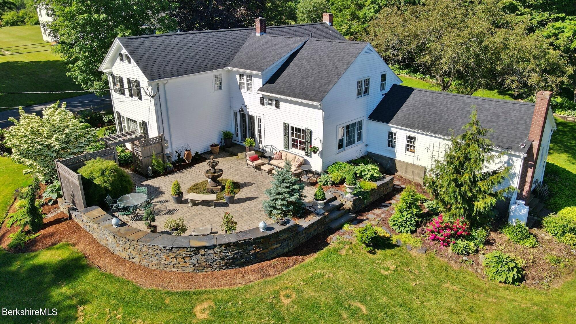 500 Devon Road Lee, MA 01238 - Photo 1 of 59 a view of a house with a yard patio and fire pit