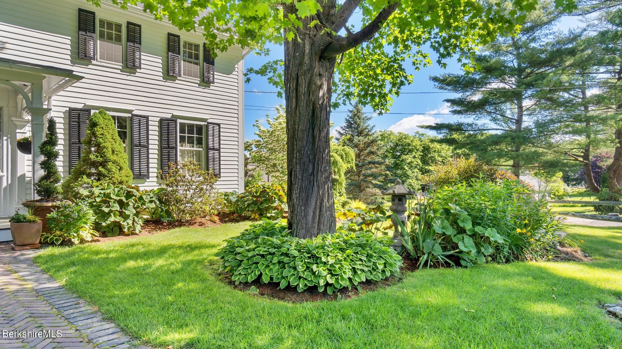 500 Devon Road Lee, MA 01238 - Photo 11 of 59 a front view of a house with garden