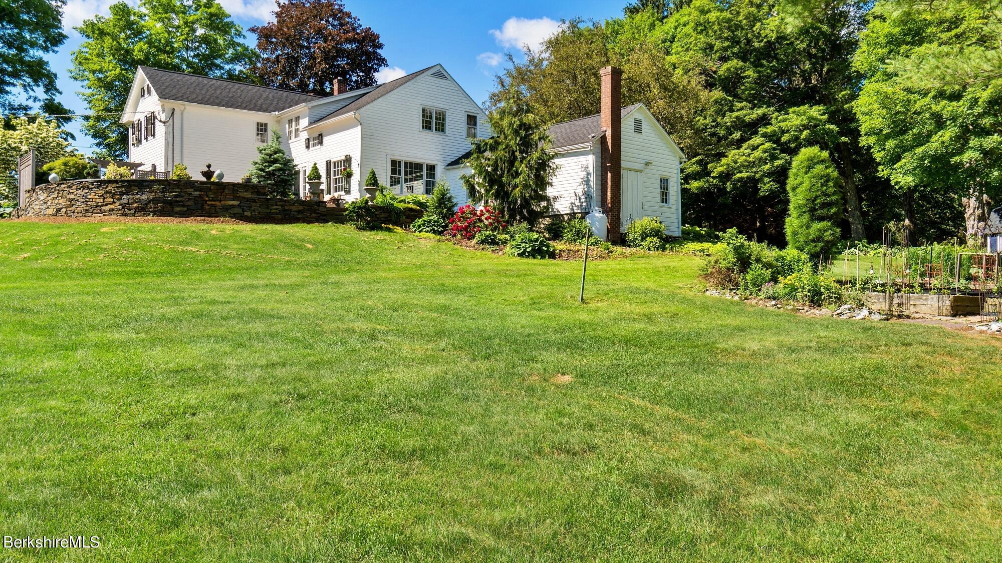 500 Devon Road Lee, MA 01238 - Photo 17 of 59 a view of a house with a yard and sitting area