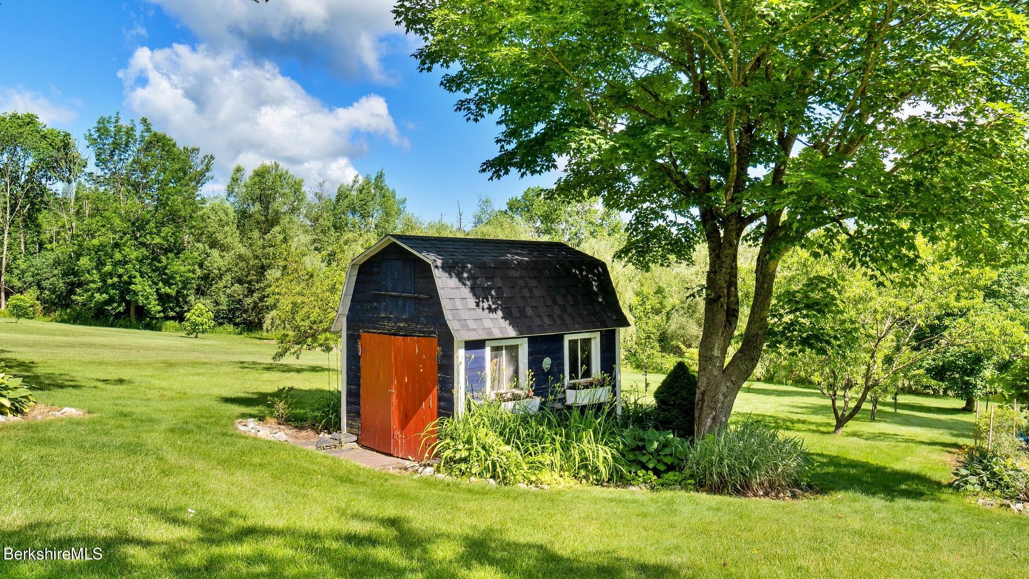 500 Devon Road Lee, MA 01238 - Photo 24 of 59 a backyard of a house with lots of green space