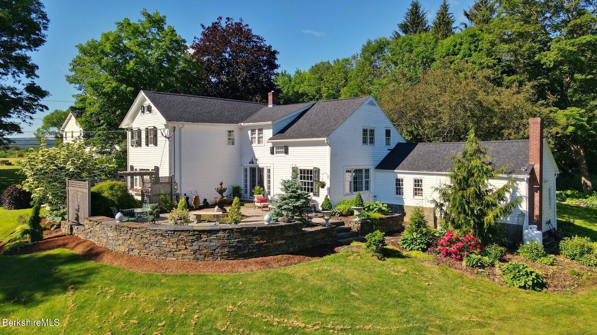 500 Devon Road Lee, MA 01238 - Photo 28 of 59 a front view of house with yard and trees around