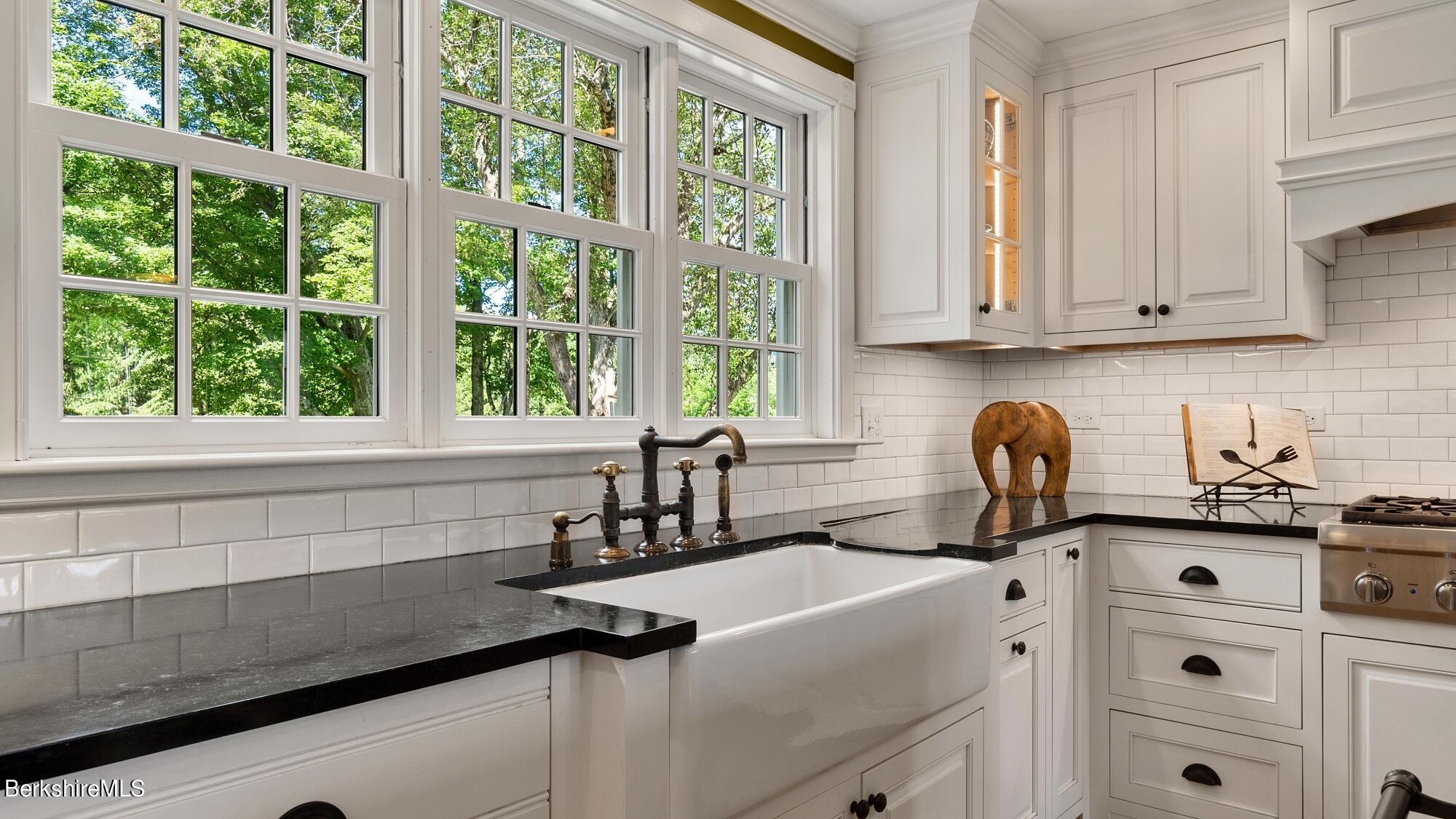 500 Devon Road Lee, MA 01238 - Photo 38 of 59 a kitchen with granite countertop a sink and a window