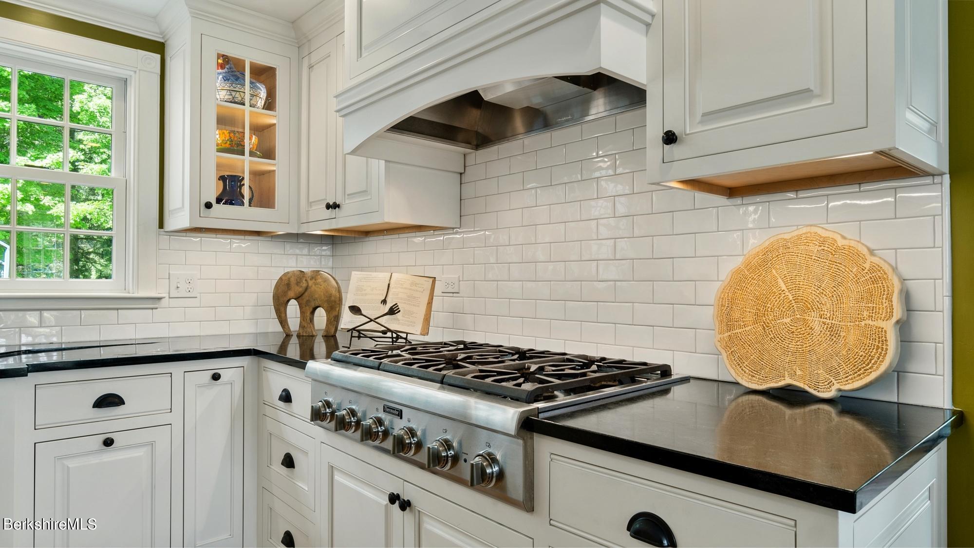 500 Devon Road Lee, MA 01238 - Photo 39 of 59 a kitchen with granite countertop a stove and a sink