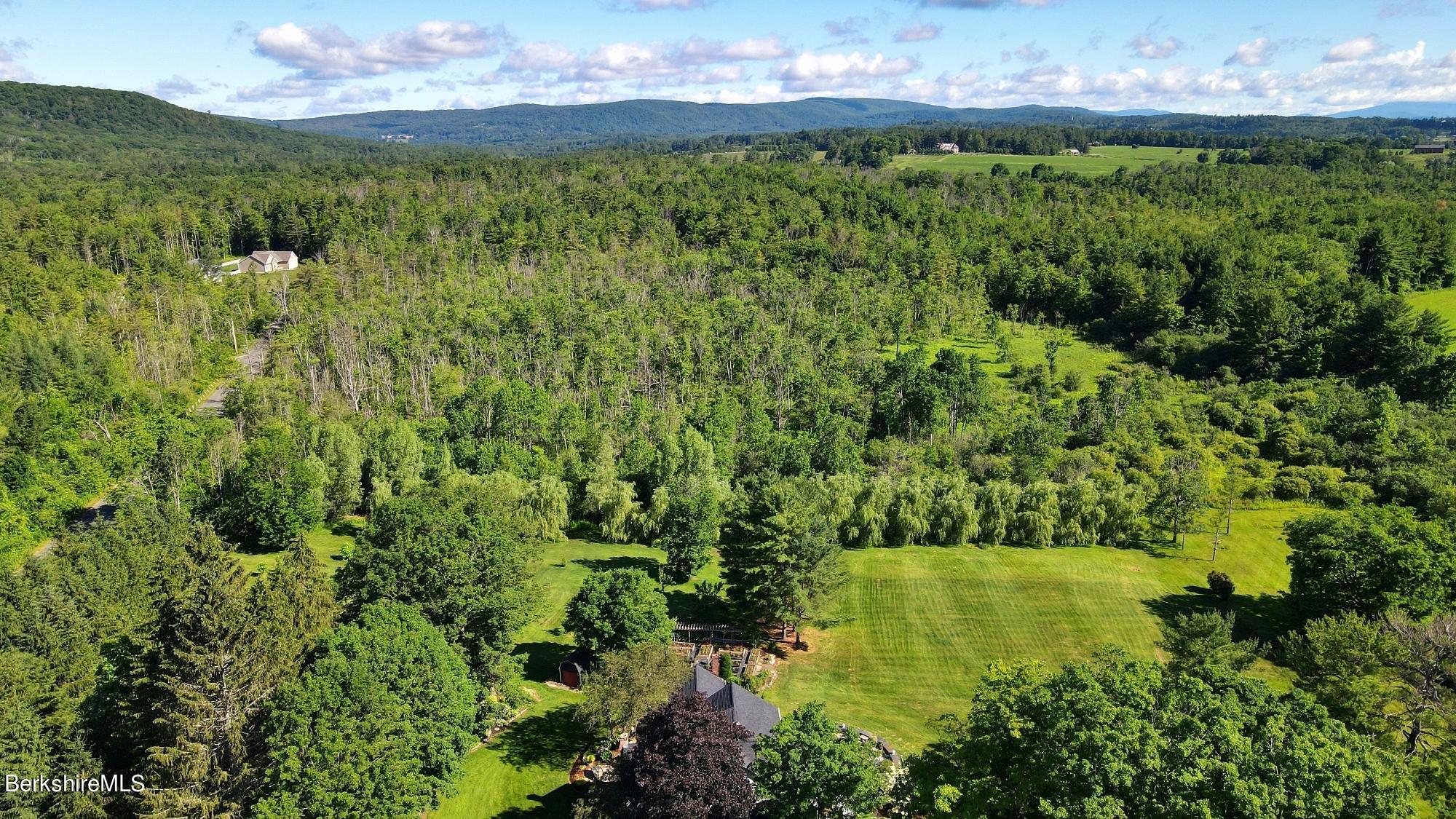 500 Devon Road Lee, MA 01238 - Photo 5 of 59 a view of a lake with a yard