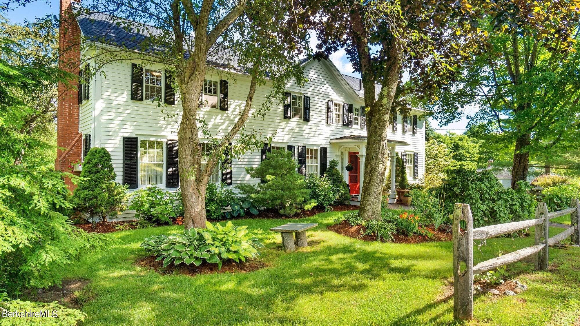 500 Devon Road Lee, MA 01238 - Photo 10 of 59 a front view of a house with garden