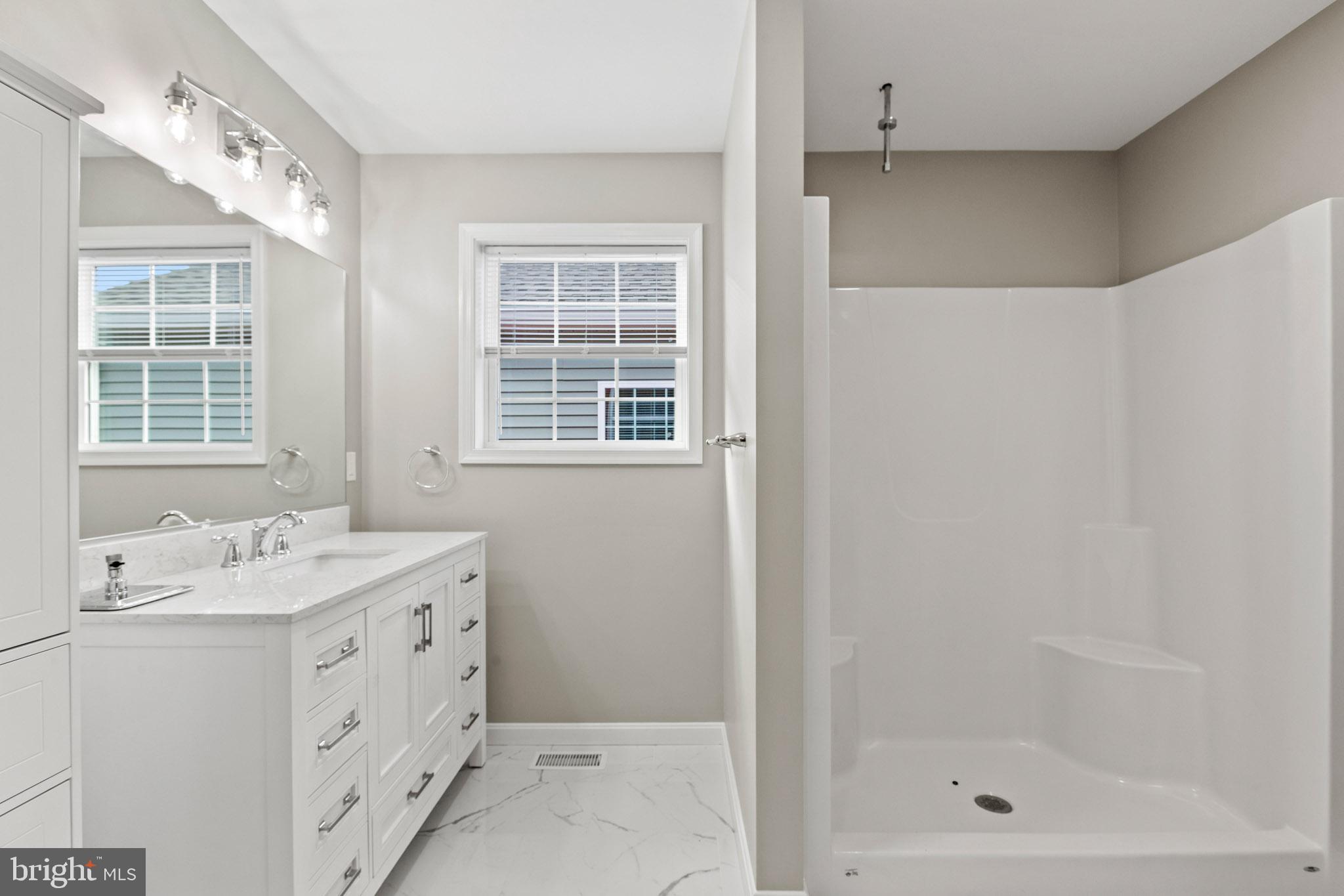 41599 Church Street Leonardtown, MD 20650 - Photo 21 of 22 a bathroom with a sink a vanity and a shower