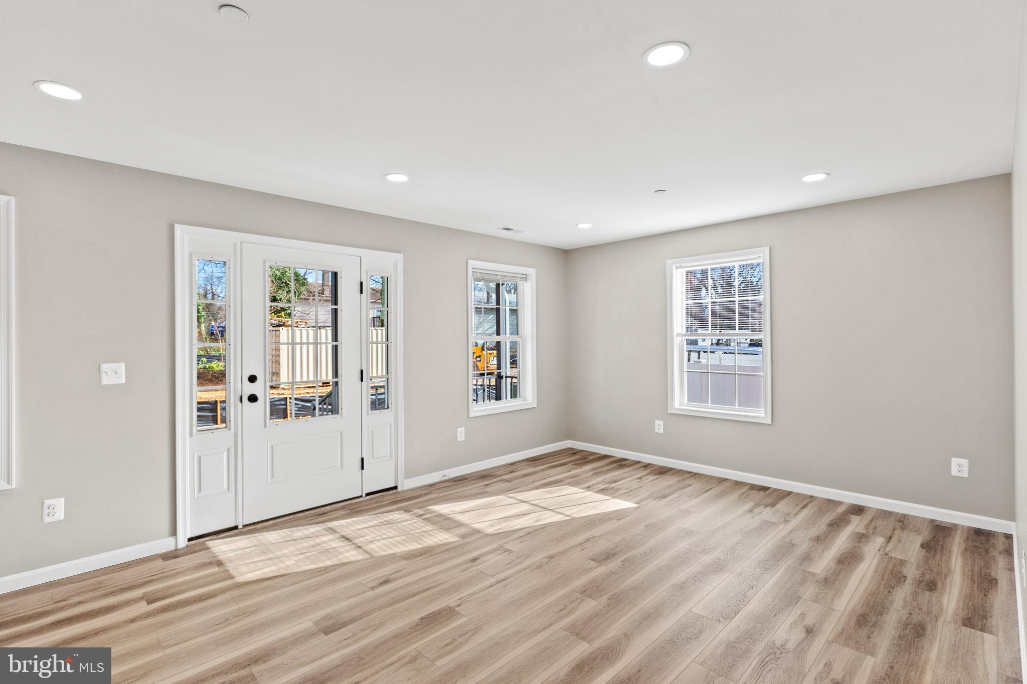 41599 Church Street Leonardtown, MD 20650 - Photo 5 of 22 a view of an empty room with wooden floor and a window