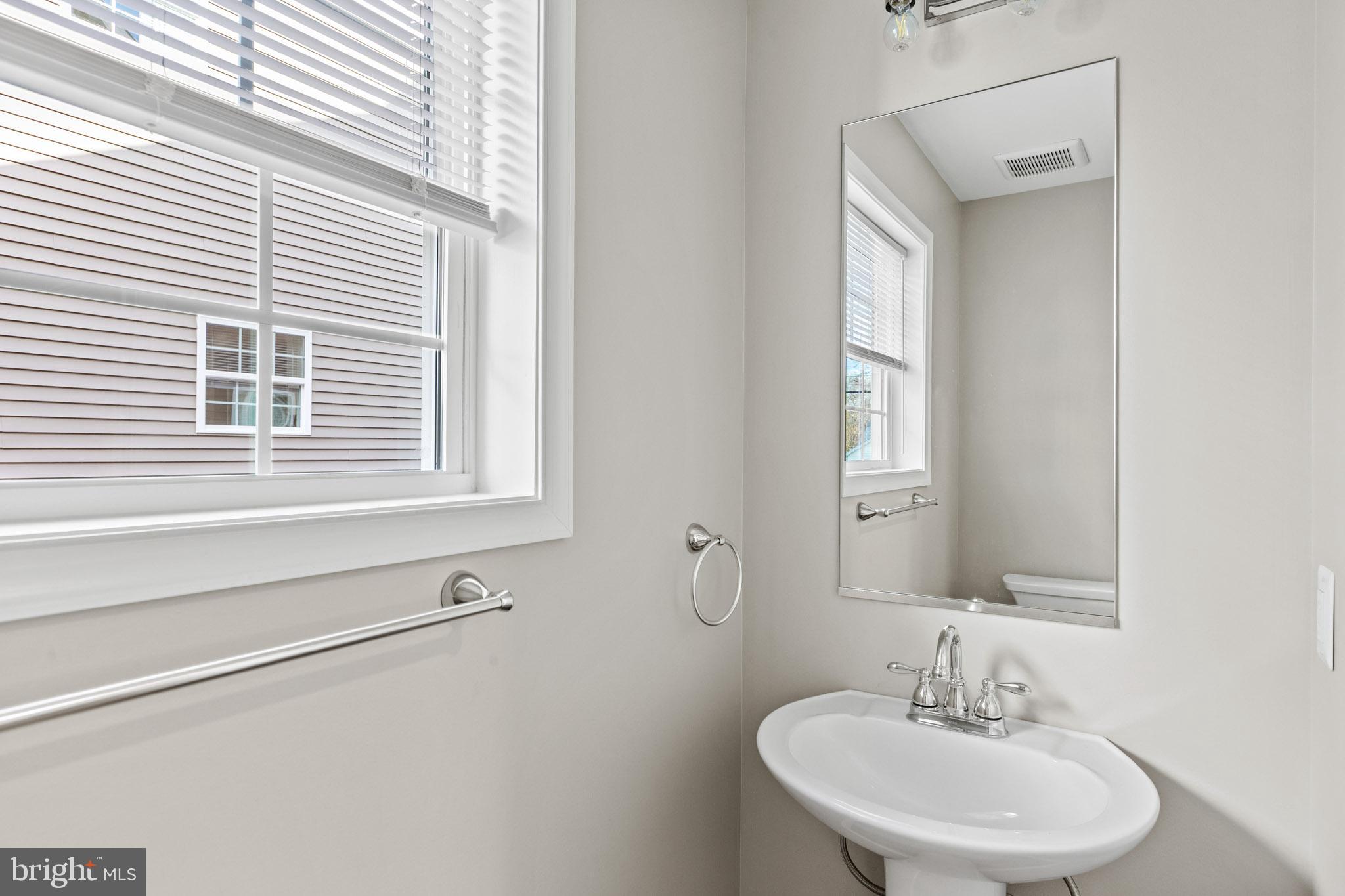 41599 Church Street Leonardtown, MD 20650 - Photo 10 of 22 a bathroom with a sink and a mirror