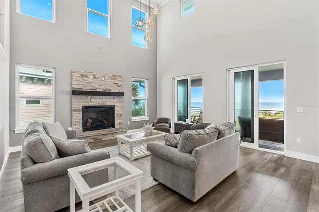 a living room with furniture a rug and a fireplace