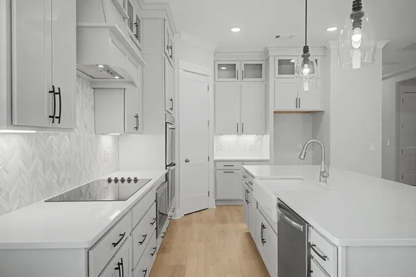 a spacious kitchen with stainless steel appliances granite countertop a sink and a stove
