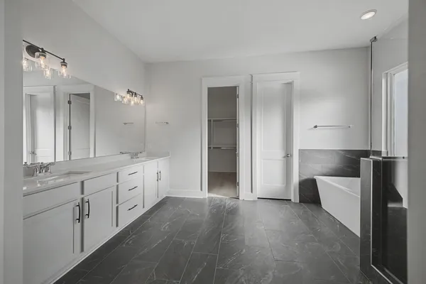 a bathroom with a bathtub and shower