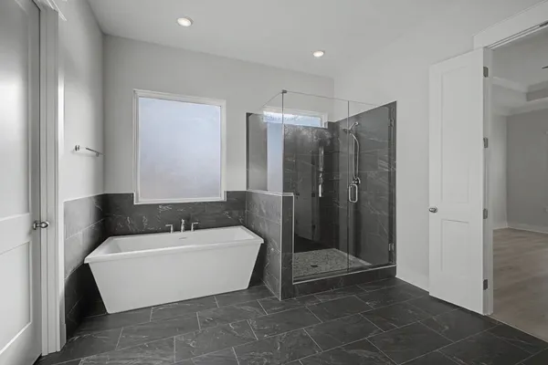 a bathroom with a glass shower door