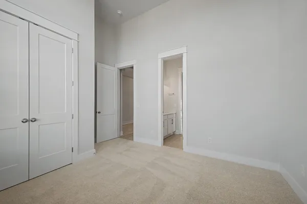 a bathroom with a double vanity sink mirror and shower