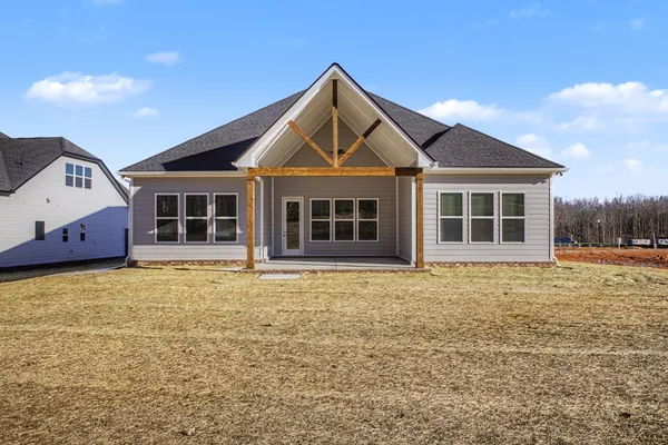 a front view of a house with a ocean view