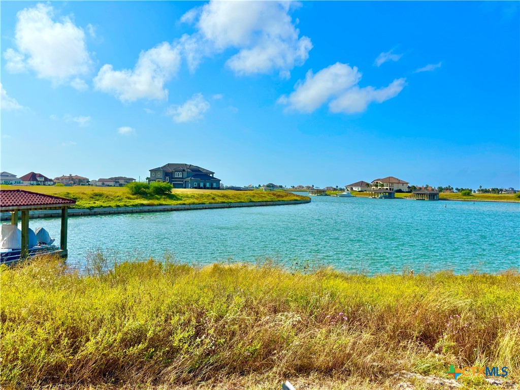 296 East Lago Loop Port O'Connor, TX 77982 - Photo 1 of 24 a view of a city with an ocean beach