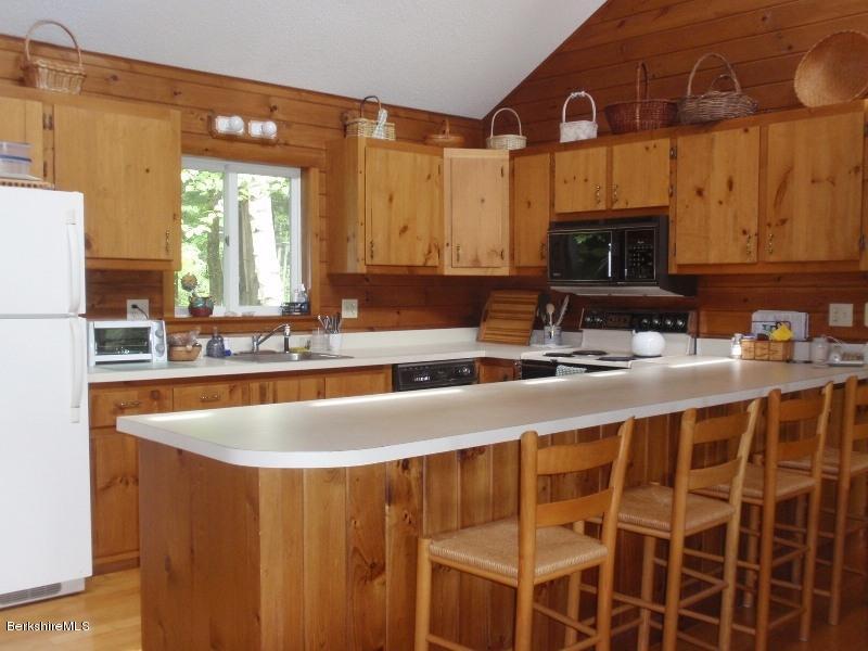 155 Bonny Rigg Hill Road Becket, MA 01223 - Photo 11 of 21 a kitchen with a sink and a stove top oven
