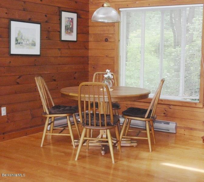155 Bonny Rigg Hill Road Becket, MA 01223 - Photo 13 of 21 a view of a dining room with furniture and wooden floor