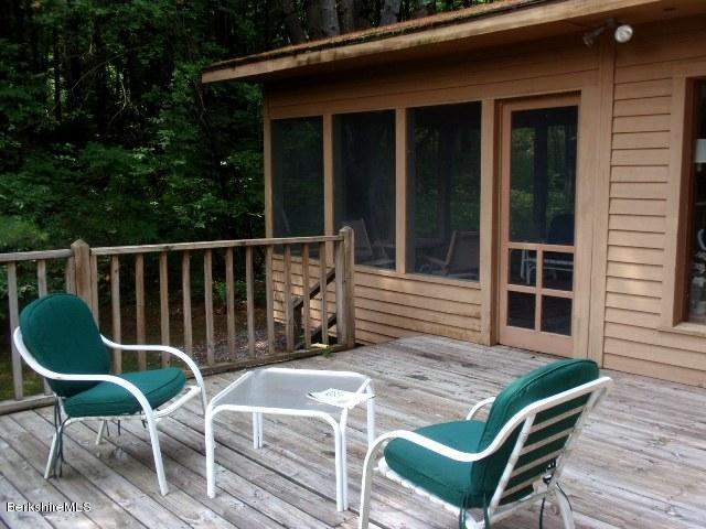 155 Bonny Rigg Hill Road Becket, MA 01223 - Photo 20 of 21 a balcony with table and chairs