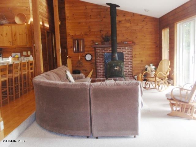 155 Bonny Rigg Hill Road Becket, MA 01223 - Photo 6 of 21 a living room with couches a coffee table and a chandelier