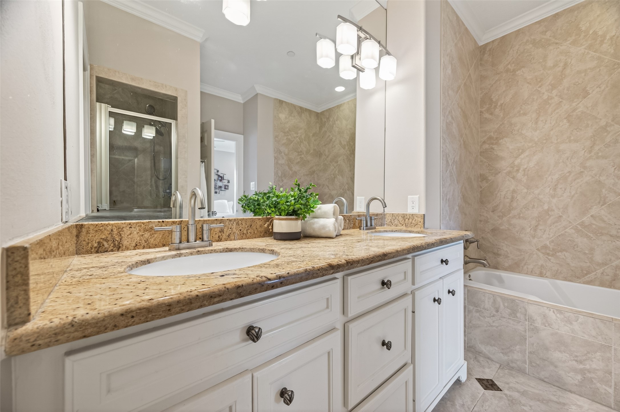 2611 Riverside Drive, Unit C Houston, TX 77004 - Photo 31 of 50 The primary bathroom features a double sink vanity with granite countertops, great cabinet space, large soaking tub and separate shower and water closest.
