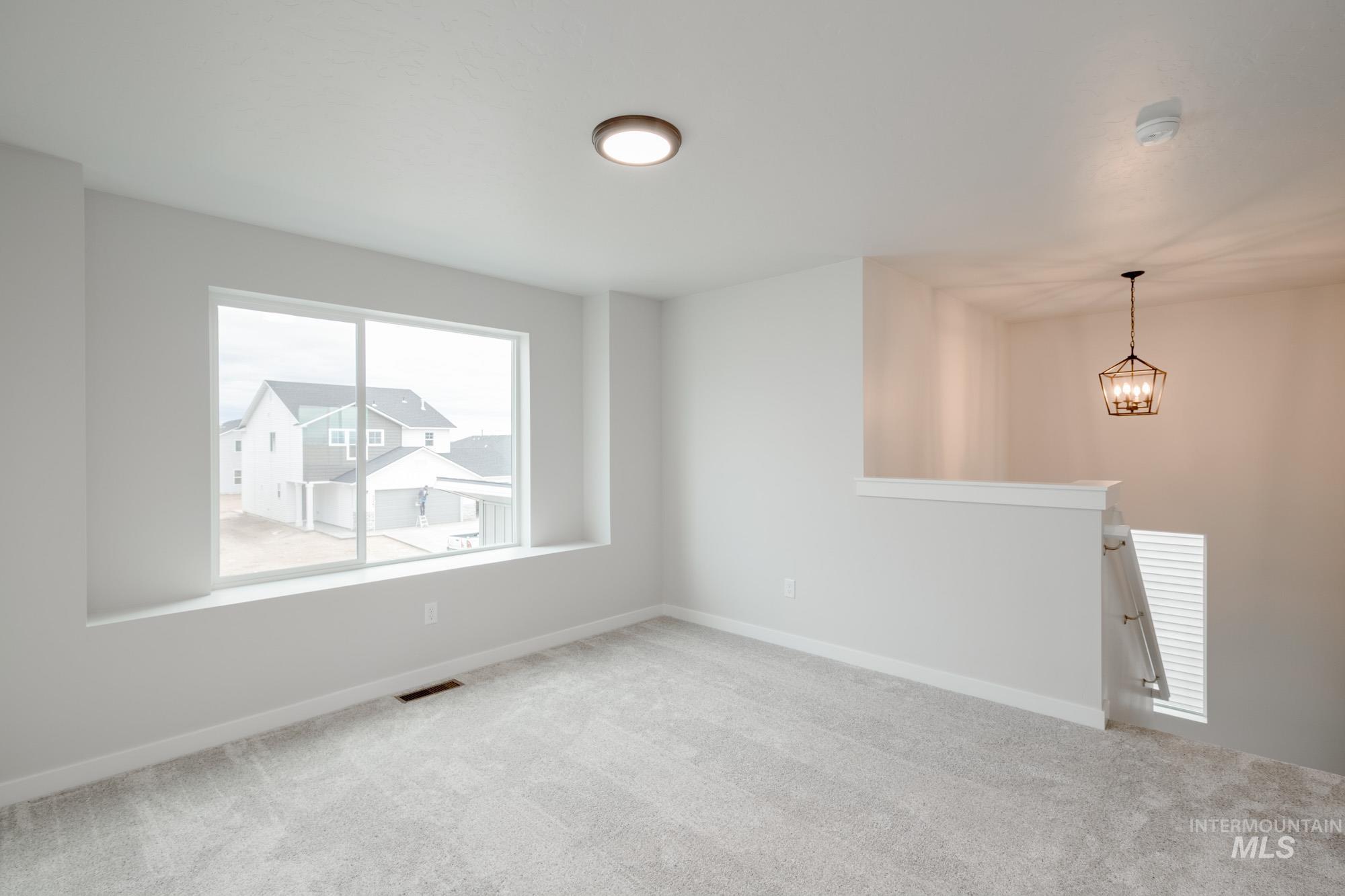 1711 North Birch Street Jerome, ID 83338 - Photo 12 of 16 Empty room with carpet flooring and baseboards