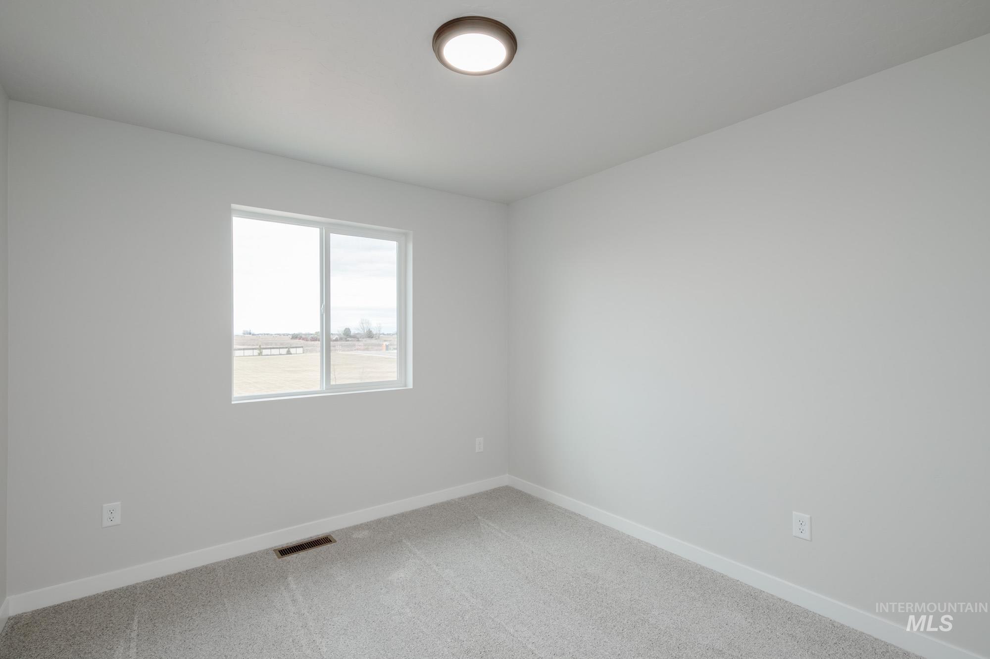 1711 North Birch Street Jerome, ID 83338 - Photo 13 of 16 Carpeted empty room featuring baseboards