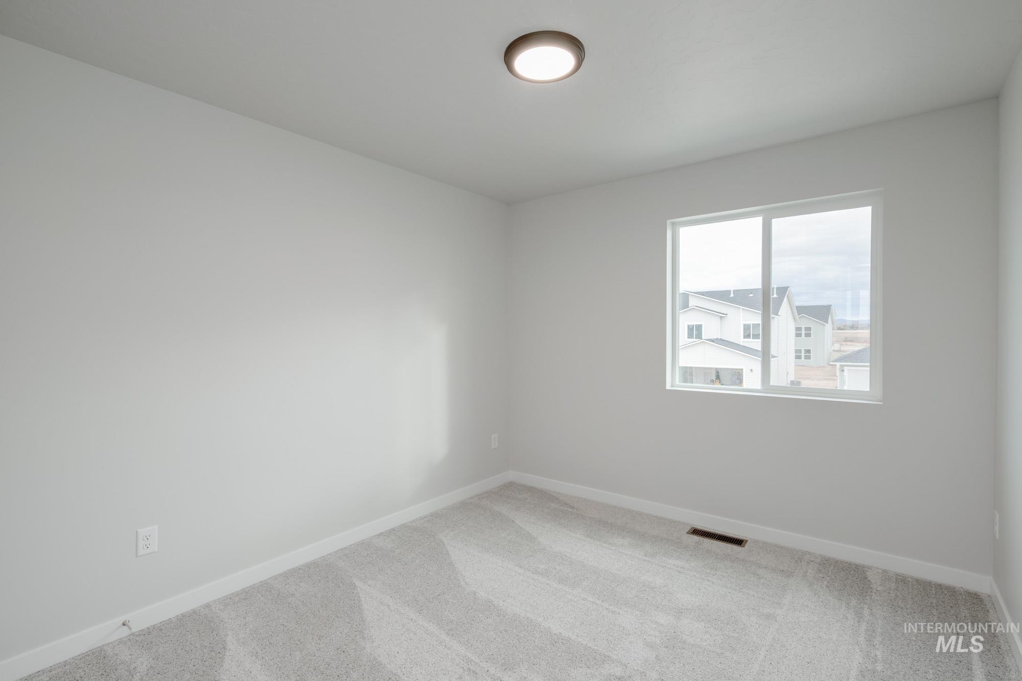 1711 North Birch Street Jerome, ID 83338 - Photo 14 of 16 Unfurnished room with carpet flooring and baseboards