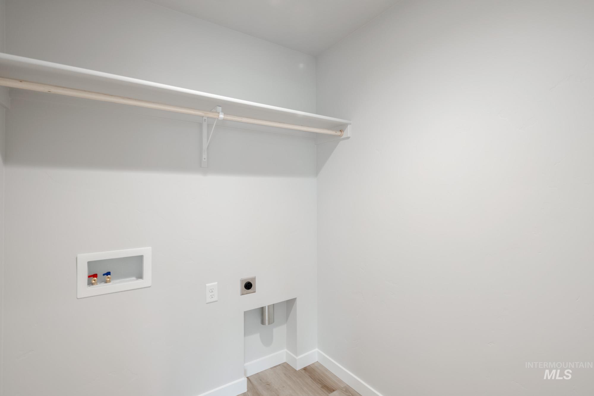 1711 North Birch Street Jerome, ID 83338 - Photo 16 of 16 Laundry area featuring washer hookup, electric dryer hookup, and light wood finished floors
