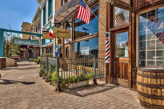 a view of shops on a street