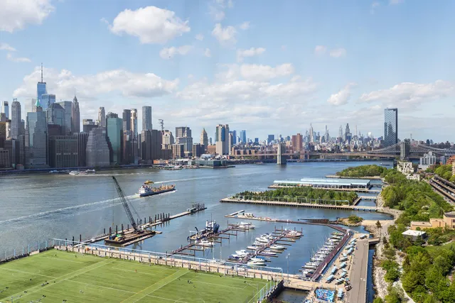 a en suite bathroom with a granite countertop sink and a mirror