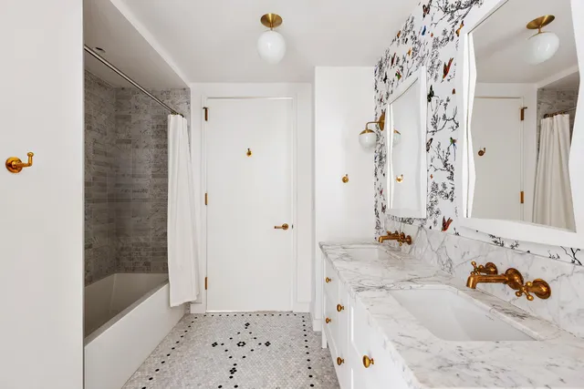 a bed room with a bed and a large window