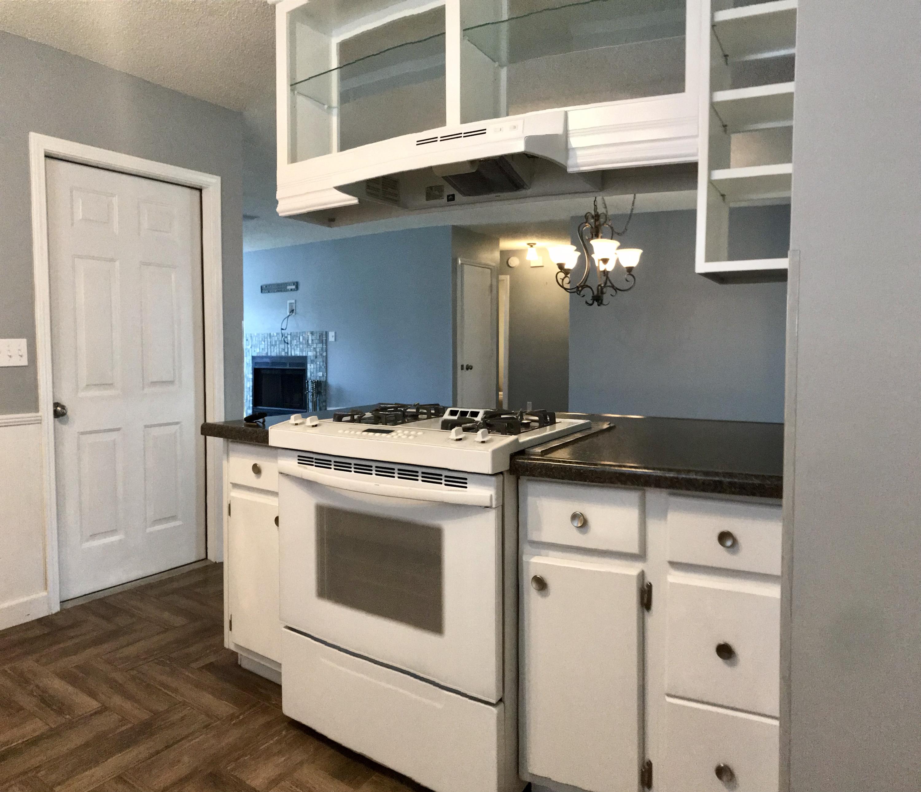 47 Ruby Circle Mary Esther, FL 32569 - Photo 18 of 30 a kitchen with a stove and a white cabinet