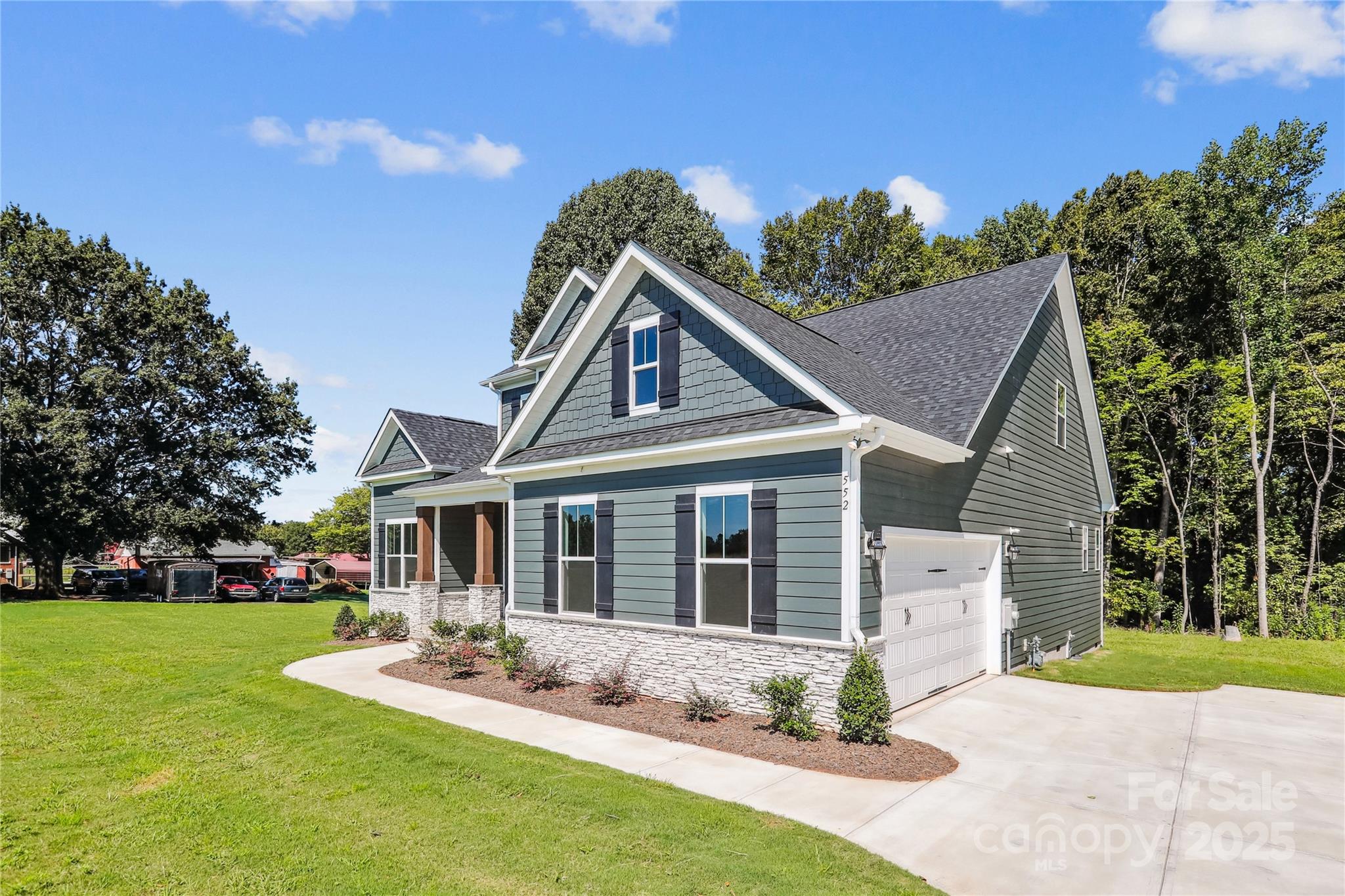 552 Fern Hill Road Mooresville, NC 28117 - Photo 2 of 12 a front view of house with yard and green space