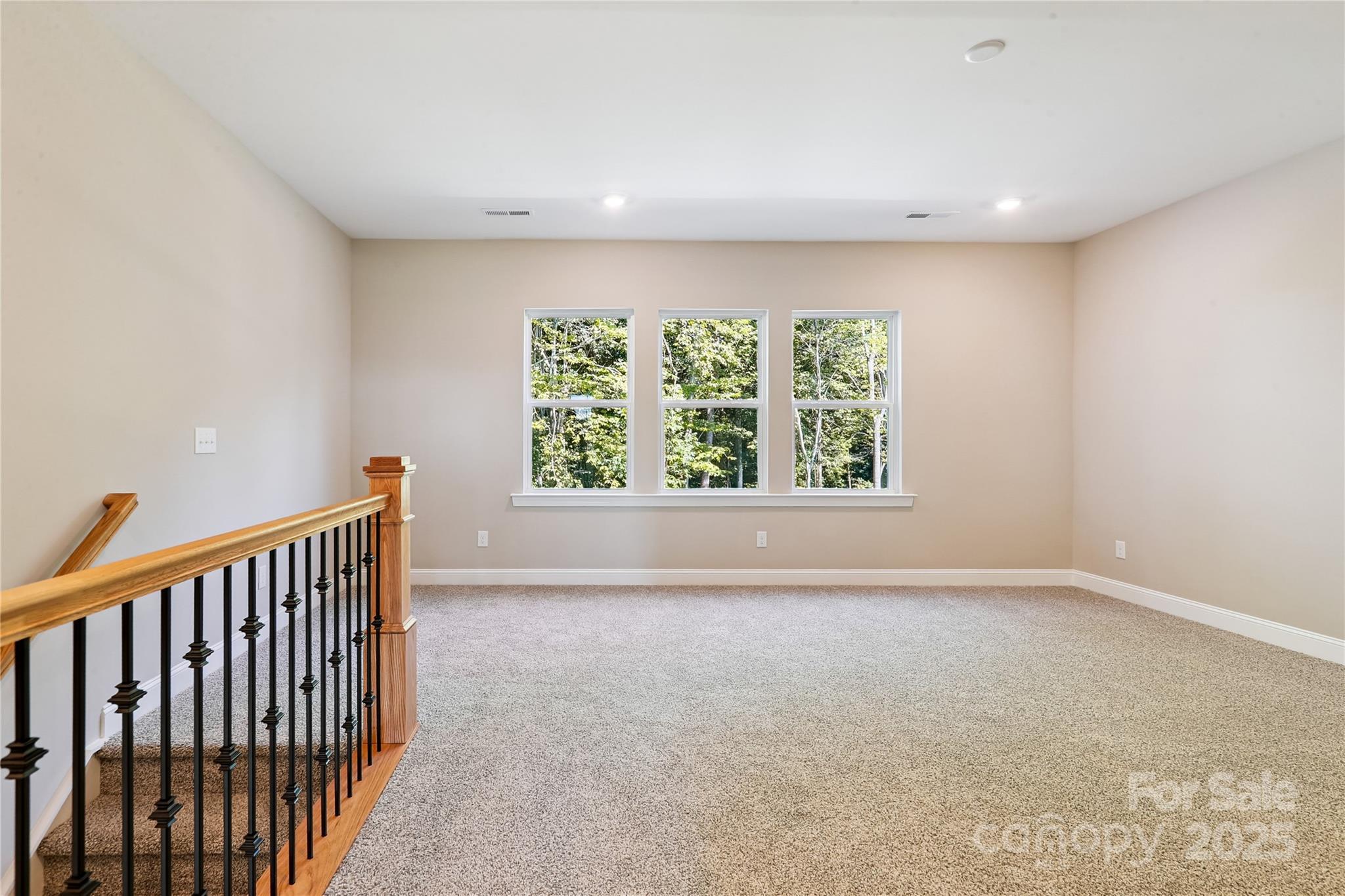 552 Fern Hill Road Mooresville, NC 28117 - Photo 5 of 12 wooden floor in an empty room with a window