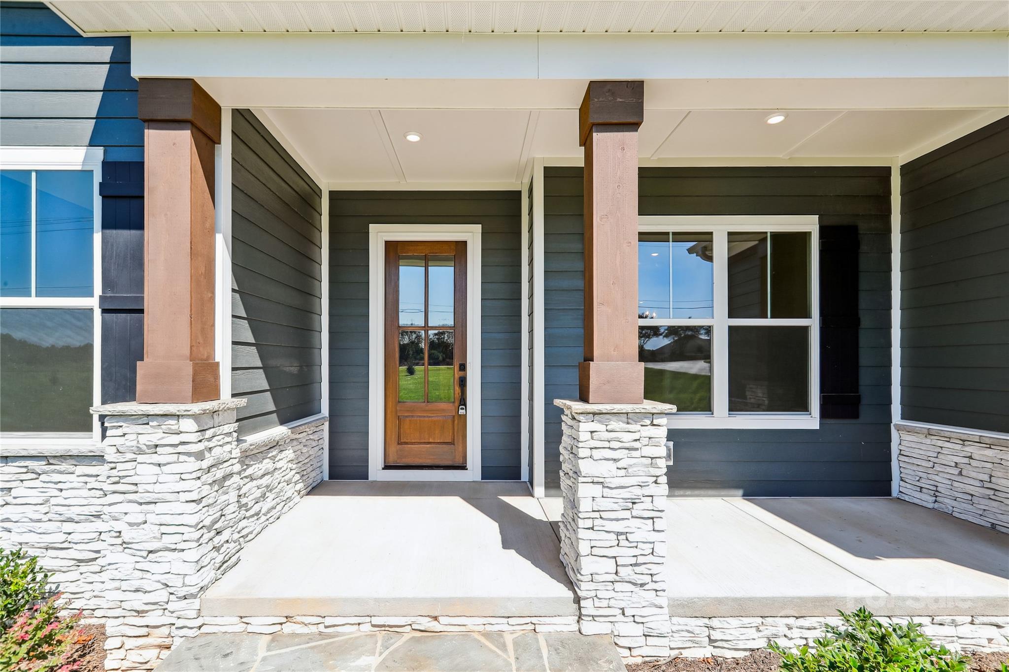 552 Fern Hill Road Mooresville, NC 28117 - Photo 6 of 12 a front view of a house with a yard