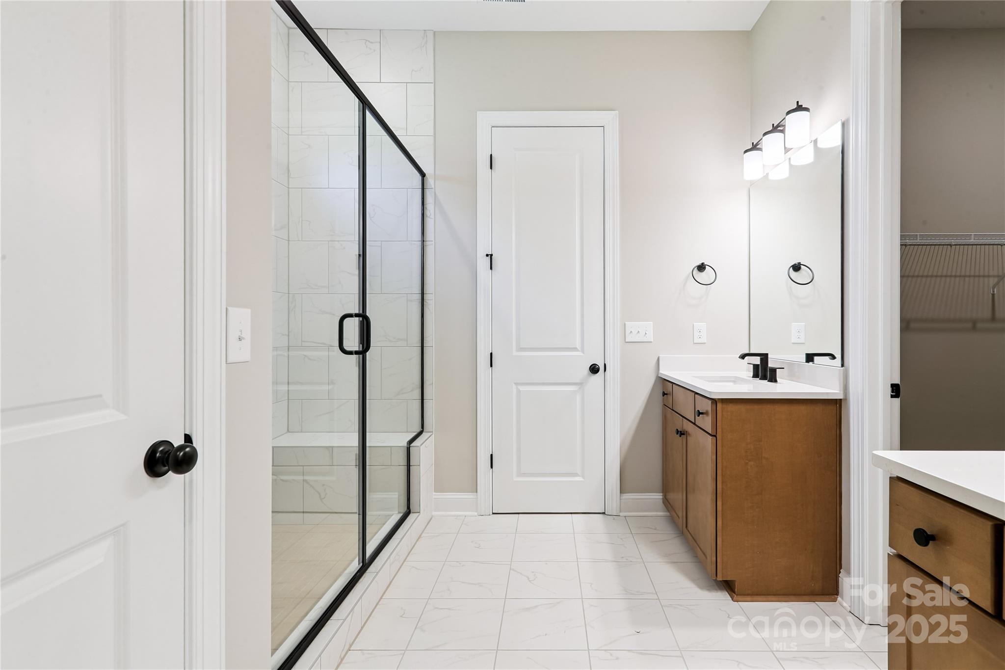 552 Fern Hill Road Mooresville, NC 28117 - Photo 7 of 12 a bathroom with a tub sink and mirror