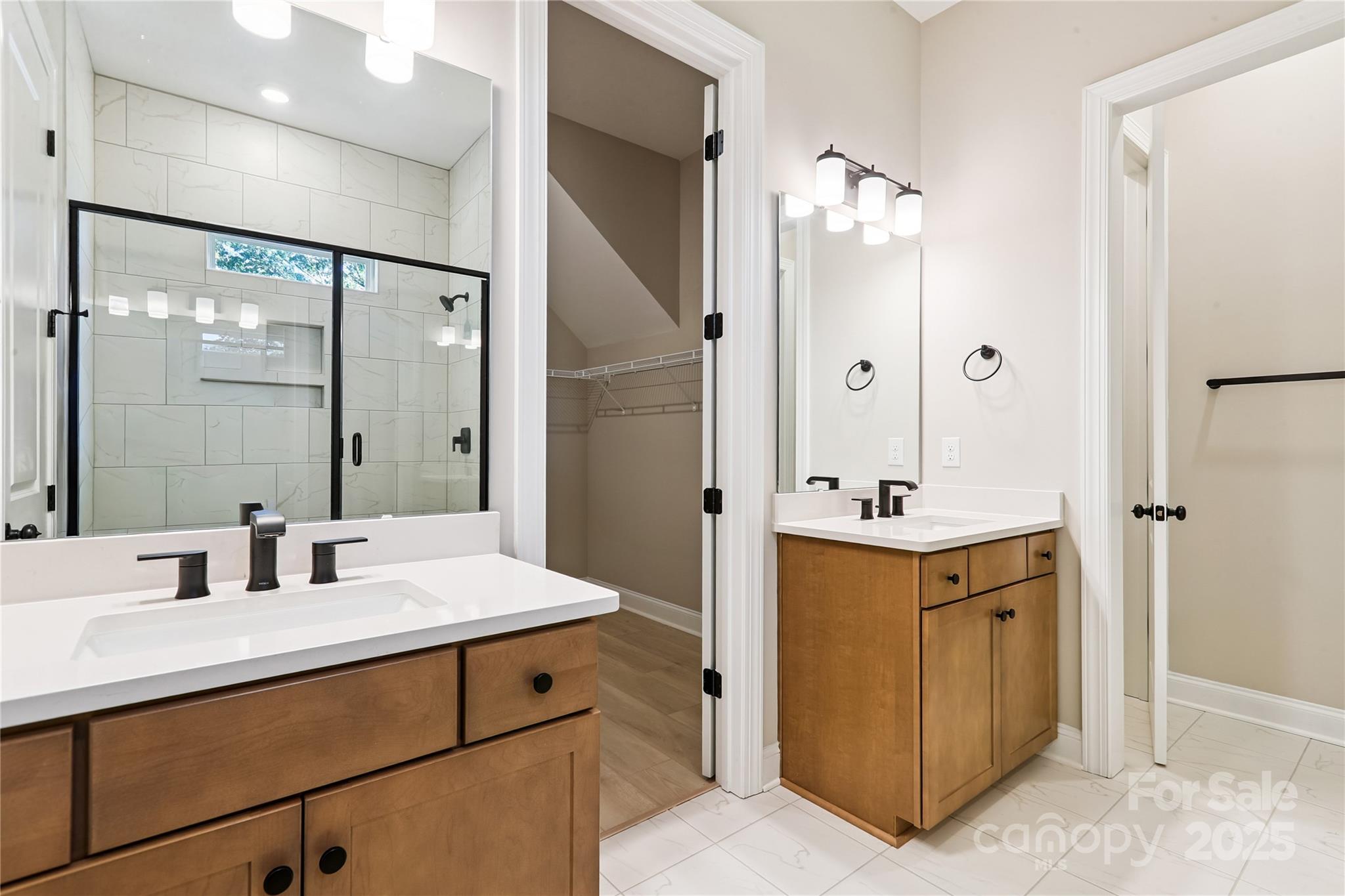 552 Fern Hill Road Mooresville, NC 28117 - Photo 8 of 12 a bathroom with a double vanity sink mirror and shower