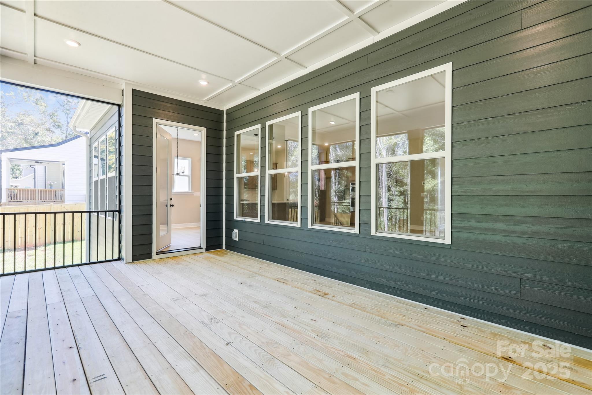 552 Fern Hill Road Mooresville, NC 28117 - Photo 10 of 12 a view of an empty room with a window