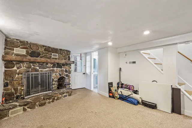 a bathroom with a sink toilet and mirror