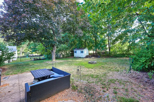 a backyard of a house with lots of green space