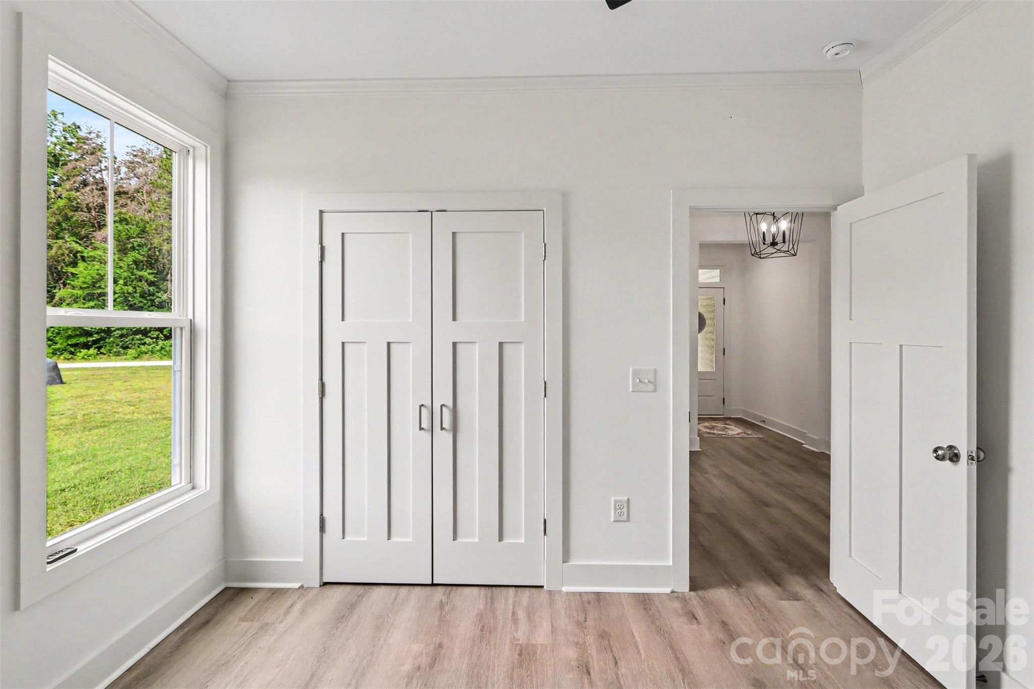 4115 Miller Road Salisbury, NC 28147 - Photo 20 of 26 a view of an empty room with wooden floor and a window