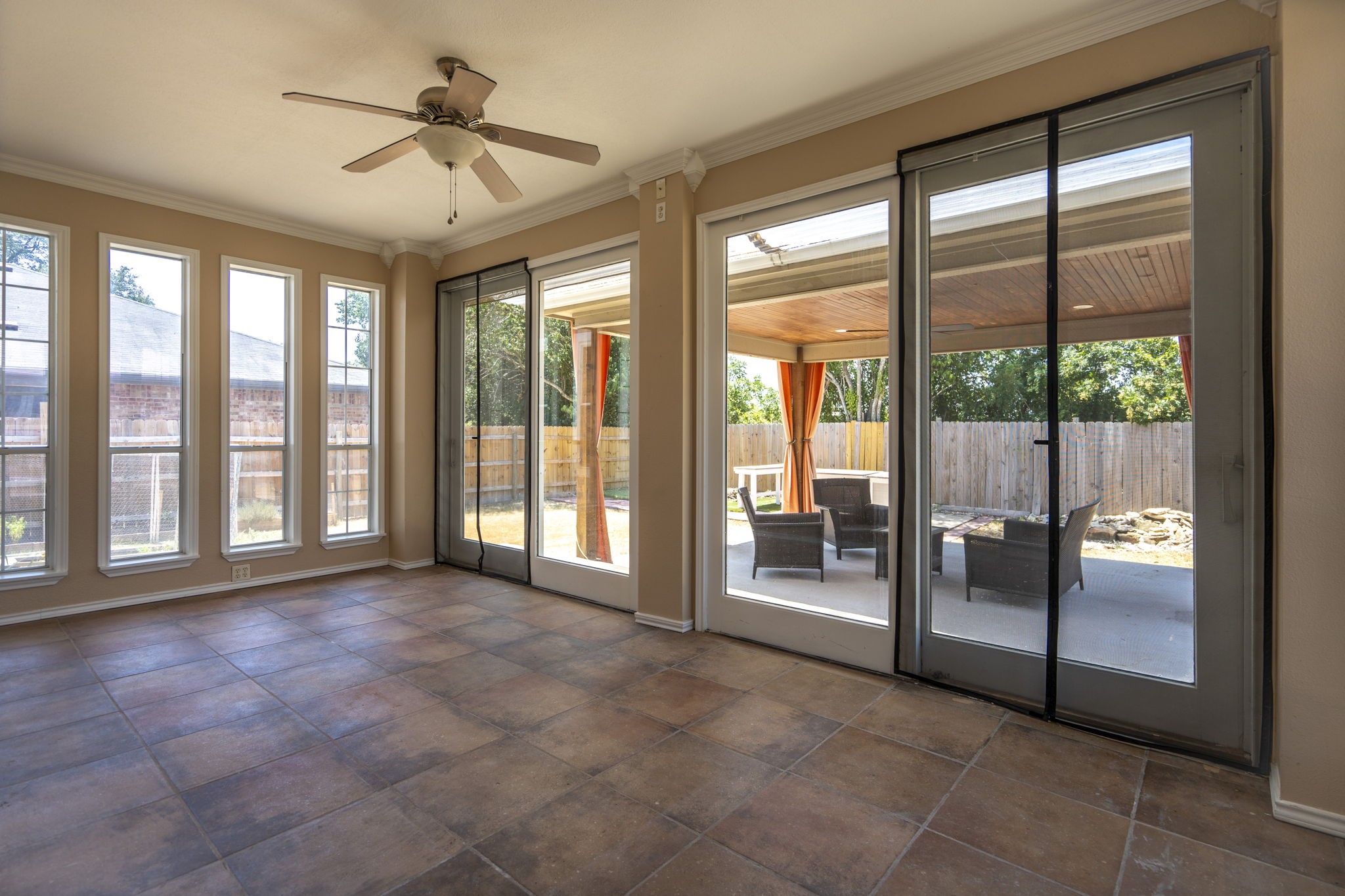 108 Colt Loop Kyle, TX 78640 - Photo 9 of 33 Spacious Sunroom off of the family room and looking out to the covered patio