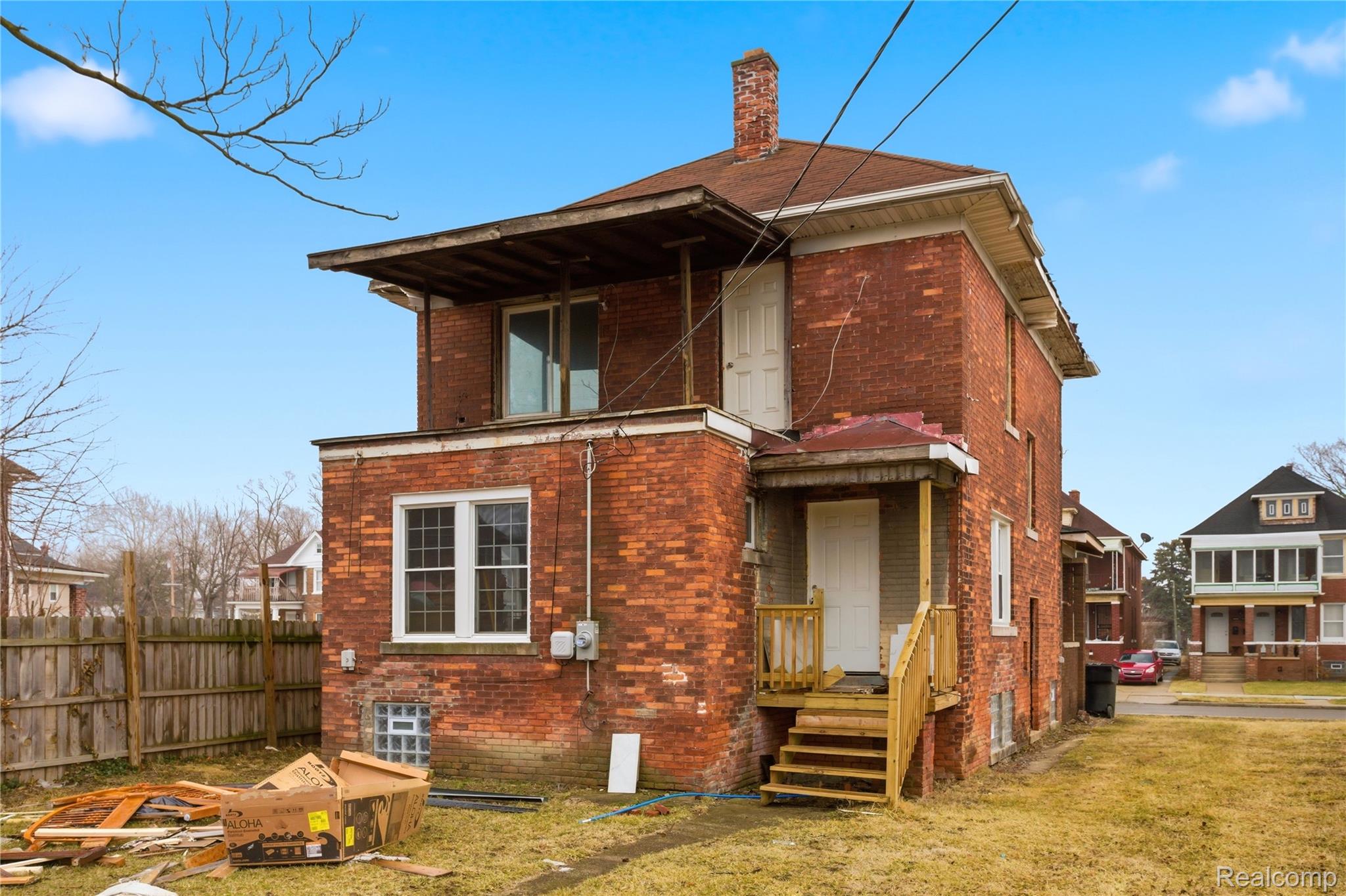 4624 Pacific Street Detroit, MI 48204 - Photo 34 of 39 Back of property with brick siding and a chimney
