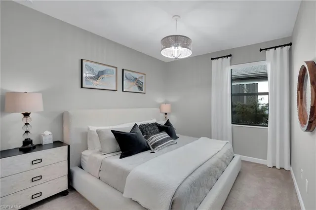 a bedroom with bed and window